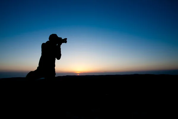 Photographer at sunset — Stock Photo, Image