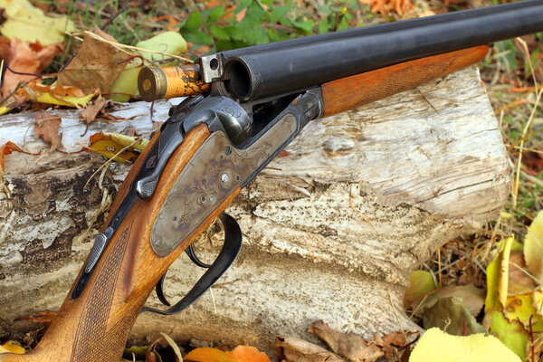 A wooden retro shotgun with shot