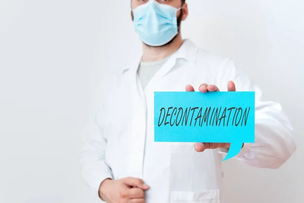 Text sign showing Decontamination. Conceptual photo neutralizing every presence of hazardous substances Laboratory Technician Featuring Empty Sticker Paper Accessories Smartphone. — Stock Photo, Image