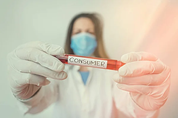Writing note showing Consumer. Business photo showcasing one that utilizes economic goods that are sold by manufacturers Laboratory blood test sample for medical diagnostic analysis.