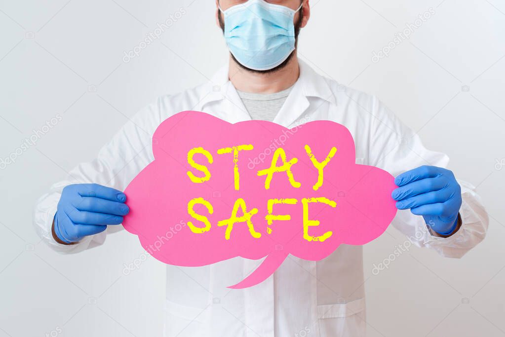 Text sign showing Stay Safe. Conceptual photo secure from threat of danger, harm or place to keep articles Laboratory Technician Featuring Empty Sticker Paper Accessories Smartphone.