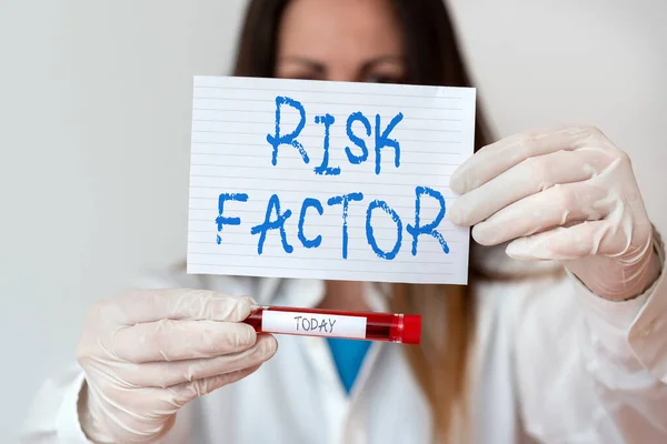 Text sign showing Risk Factor. Conceptual photo Characteristic that may increase the percentage of acquiring a disease Laboratory blood test sample shown for medical diagnostic analysis result.