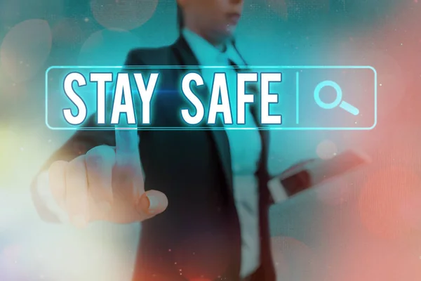 Conceptual hand writing showing Stay Safe. Business photo text secure from threat of danger, harm or place to keep articles Web search digital futuristic technology network connection.