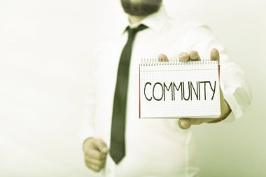 El yazısı Cemaati. Anlam kavramı ortak bir özellik ya da ilgi ile birlikte yaşayan model farklı boş renk not defteri maketi yazma fikri görüntüler.