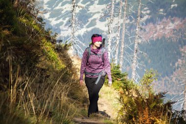 Girl walk over the mountains, Czech mountains Krkonose clipart