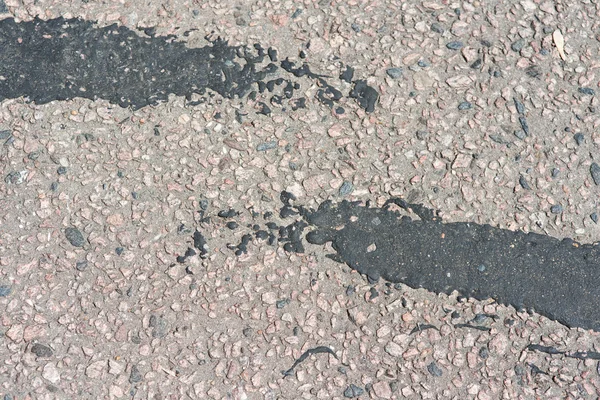 Textura de asfalto com grandes manchas pretas — Fotografia de Stock