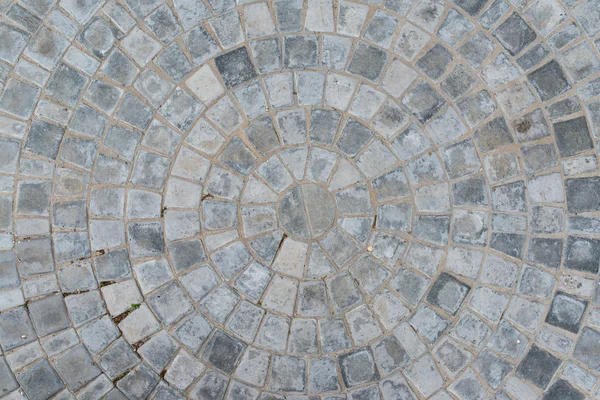 Kopfsteinpflaster kreisförmige Muster blockieren Straßenbelag Textur. Ansicht von oben — Stockfoto