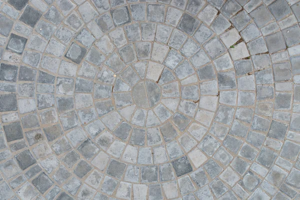 Kullersten cirkulärt mönster block trottoaren textur bakgrund. Ovanifrån — Stockfoto