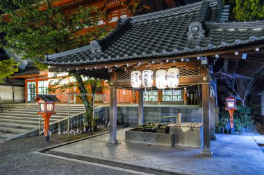 Yasaka Shrine main gate's purification fountain in Kyoto, Japan clipart