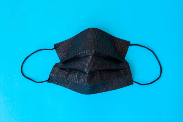 Máscara Médica Negro Covid Icono Aislado Sobre Fondo Azul — Foto de Stock