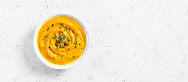 Pumpkin puree in bowl over light stone background with free text space. Healthy diet food concept. Top view, flat lay — Stock Image Pumpkin Puree Bowl Light Stone Background Free Text Space Healthy Stock Picture