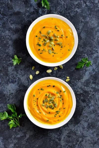 Pumpkin puree in bowls over blue stone background. Healthy diet food concept. Top view, flat lay — Stock Image Pumpkin Puree Bowls Blue Stone Background Healthy Diet Food Concept Stock Image