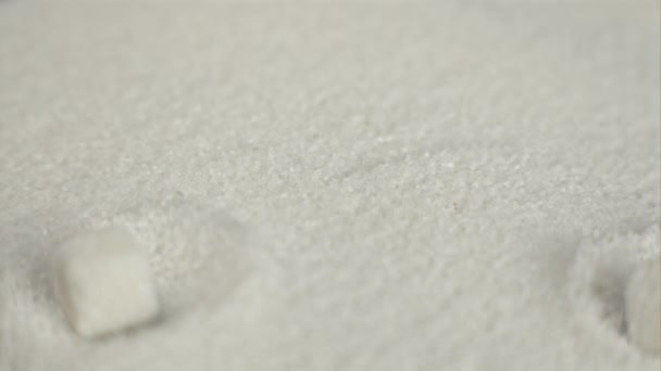 Super slow motion drop pieces of white sugar. Filmed on a high-speed camera 1000 fps. — Stock Video