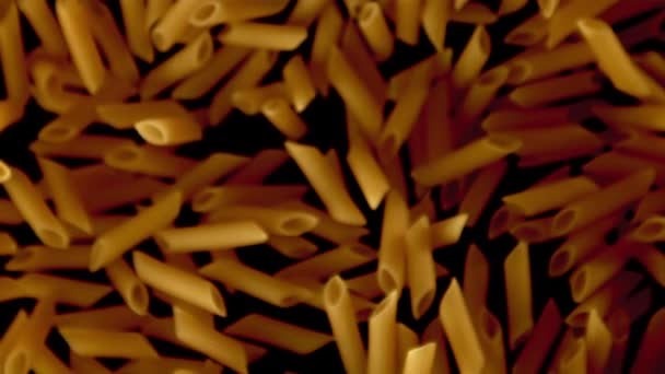 Super slow motion torr penne pasta. På en svart bakgrund.Filmad på en höghastighetskamera på 1000 fps. — Stockvideo