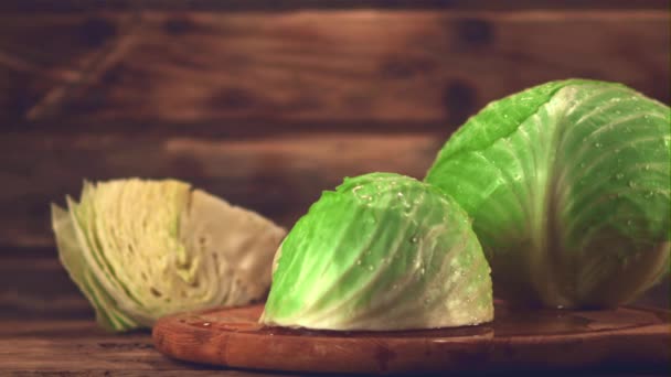 Super slow motion cabbage is chopped with a knife on a cutting board.Filmed at 1000 fps. — Wideo stockowe