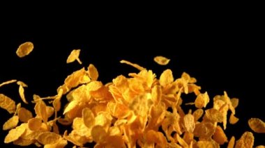 Super slow motion cornflakes take off against a black background. Filmed on a high-speed camera at 1000 fps.