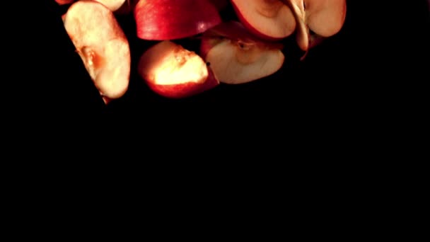 Super slow motion pieces of red apple fall into the water with splashes. Filmed on a high-speed camera at 1000 fps. — Stock Video