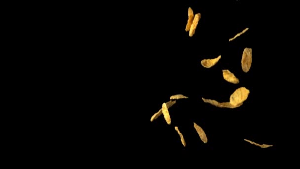 Superslow motion cornflakes vallen op tafel. Gefilmd op een hoge snelheidscamera met 1000 fps. — Stockvideo