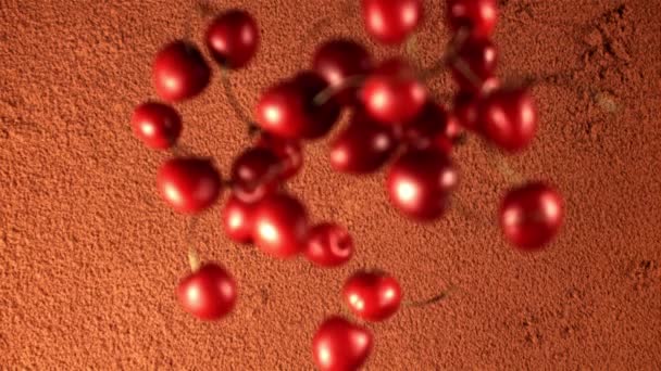 Super slow motion fresh cherry falls on the cocoa powder. Filmed on a high-speed camera at 1000 fps. — Stock Video