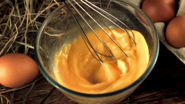 Super slow whisk movement stirred eggs for breakfast preparation. Filmed on a high-speed camera at 1000 fps. — Stock Video