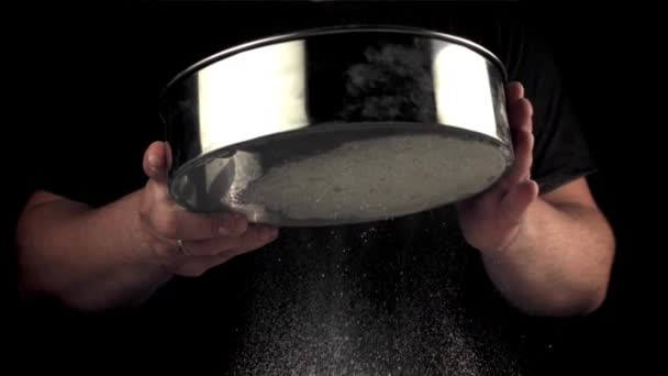 Super slow motion of the mans hand sift the flour through a baking sieve. Filmed on a high-speed camera at 1000 fps. — Stock Video