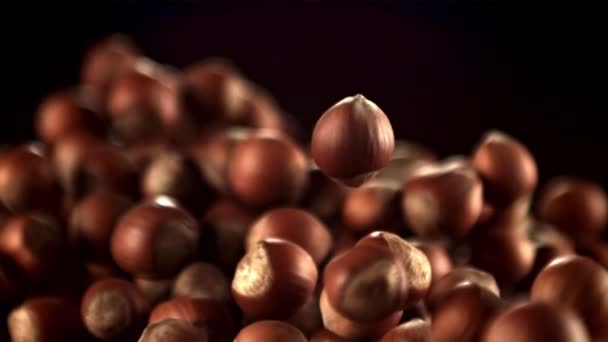 Super slow motion hazelnuts rise up and fall down. Filmed on a high-speed camera at 1000 fps. — Stock Video