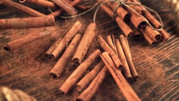 Super slow motion cinnamon sticks take off from a wooden table. Filmed on a high-speed camera at 1000 fps. — Stock Video