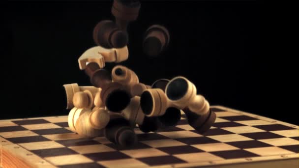 Super slow motion chess pieces fall on the chessboard. Filmed on a high-speed camera at 1000 fps. — Stock Video