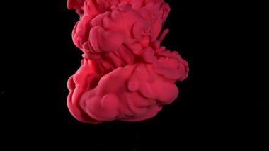 Siyah arka planda, suda kırmızı boya. 1000 fps 'de yüksek hızlı bir kamerayla çekildi. Yüksek kaliteli FullHD görüntüler