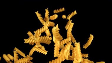 Süper yavaş çekimde uçan fusilli makarna kurudu. 1000 fps 'de yüksek hızlı bir kamerayla çekildi. Yüksek kaliteli FullHD görüntüler