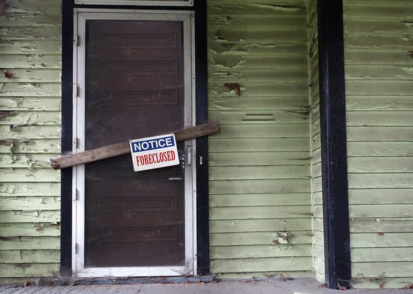 Foreclosed house door — Stock Photo, Image