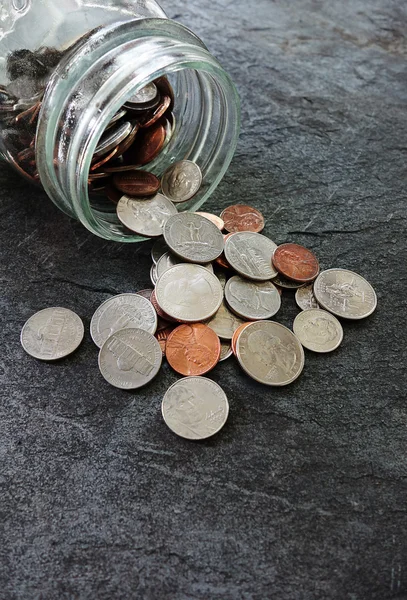 Spilled coin jar — Stock Photo, Image