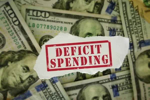 Deficit Spending Text Red Hundred Dollar Bills — Stock Photo, Image