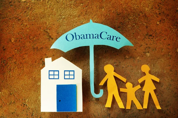 Family Obama Care umbrella — Stock Photo, Image