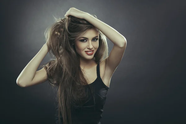 Smiling young woman with long hair Royalty Free Stock Images