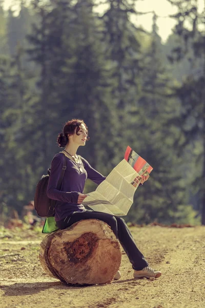 Woman reading travel map