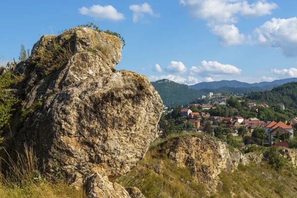 Cityscape with big rock — Stock Photo, Image