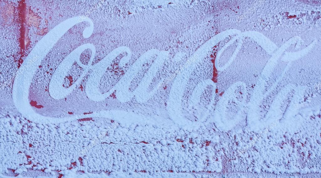 POIANA BRASOV, ROMANIA - FEBRUARY 11, 2015: Frozen Coca-Cola advertising sign, one of the worlds most famous soft drinks company.
