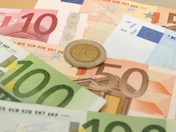 Euro banknotes and coins — Stock Photo, Image