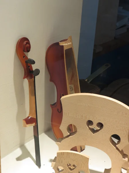 Violin parts on display in a music store