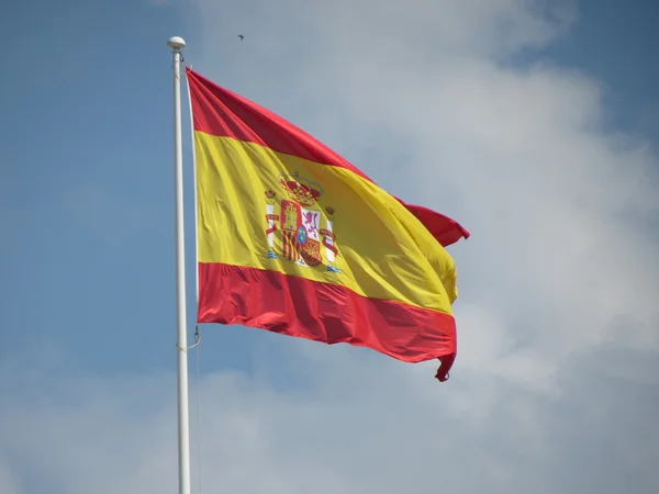 Bandeira espanhola flutuante — Fotografia de Stock