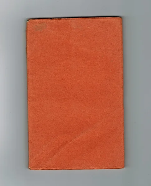 Boek Met Oranje Cover Grijze Achtergrond — Stockfoto