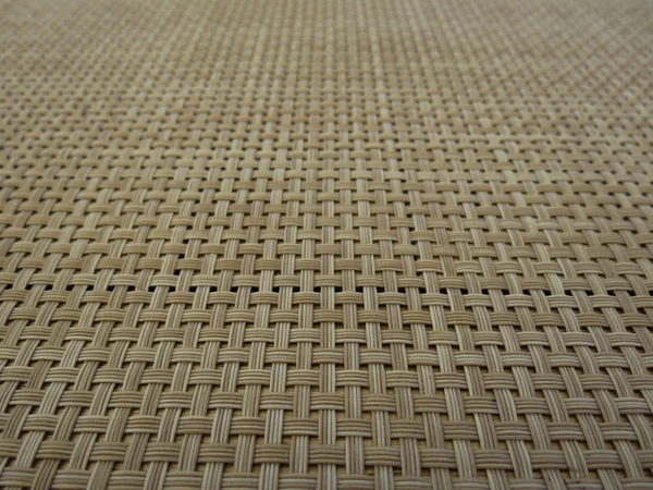 Table mat with fake straw threads woven useful as a background