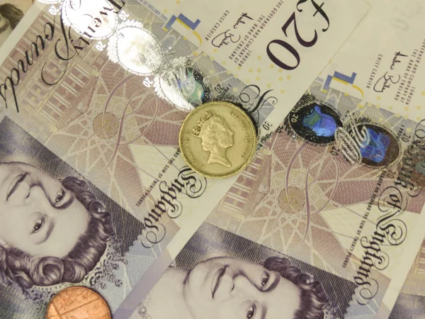 2014 ロンドン イギリスの英ポンド Gbp 紙幣と硬貨女王エリザベス 世の肖像画を軸受 — ストック写真