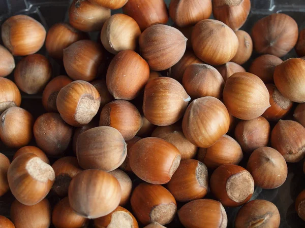Hazelnuts полезно в качестве фона — стоковое фото