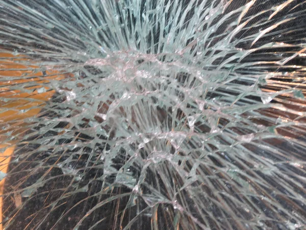 Smashed window glass useful as risk or danger concept