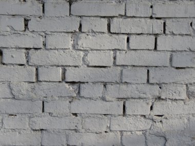 Beyaz bir arka plan olarak yararlı boyalı bir tuğla duvar detay