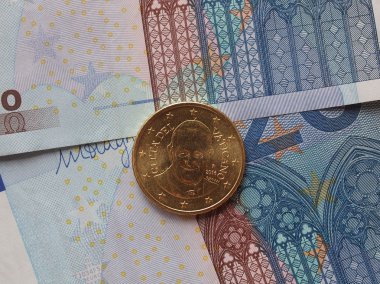 20 Euro (Eur) banknotlar yararlı bir arka plan veya para kavram - bir elli Euro olarak sikke Papa Bergoglio Francis portresini taşıyan Vatikan'dan ben
