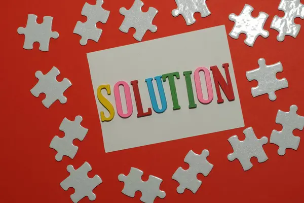 Solution Word Jigsaw Puzzle Red Background — Stock Photo, Image