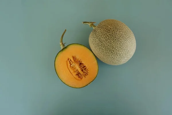 honeydew melon fruit on the green background